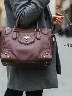 Woman demonstrating smart shopping with designer fashion in 2025