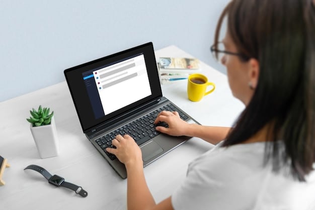 A person working at a desk with a clean, modern laptop displaying an email marketing platform's interface. The platform shows a drag-and-drop email builder with various design elements, text blocks, and image placeholders. The person's hands are on the keyboard, suggesting they are actively creating and editing an email campaign.