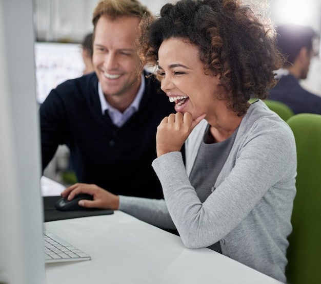 A customer service representative calmly typing a response to a negative review on a laptop, with a friendly smile and a supportive colleague in the background.