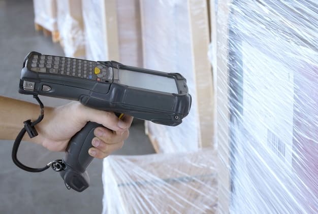 A close-up shot of a barcode scanner being used to scan a product in a warehouse, highlighting the use of technology for real-time inventory tracking.